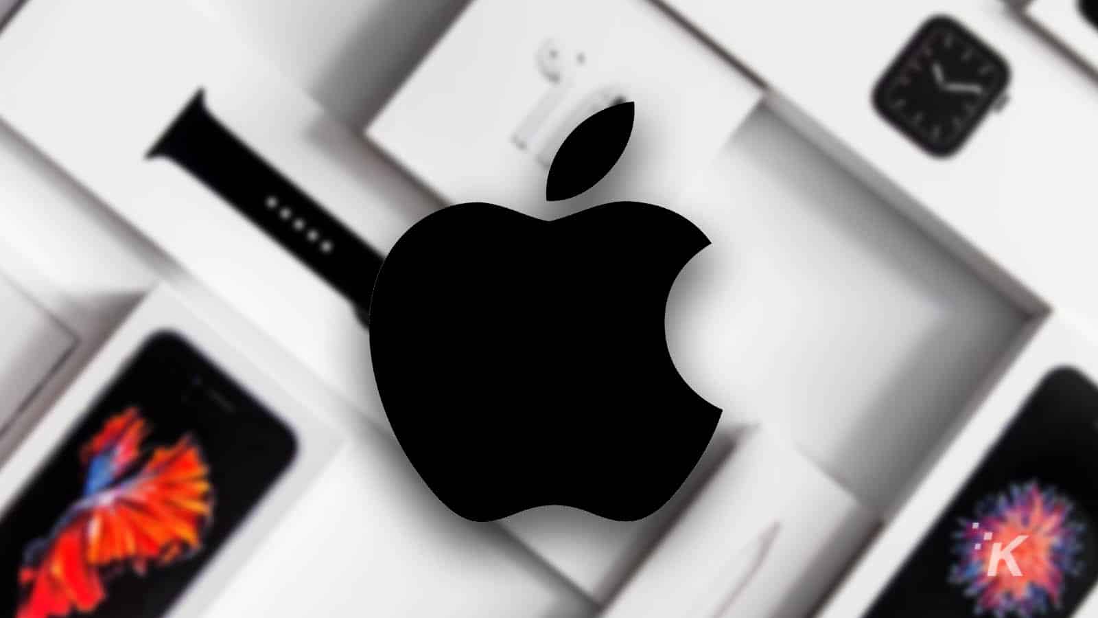 苹果标志和苹果产品在背景中模糊
